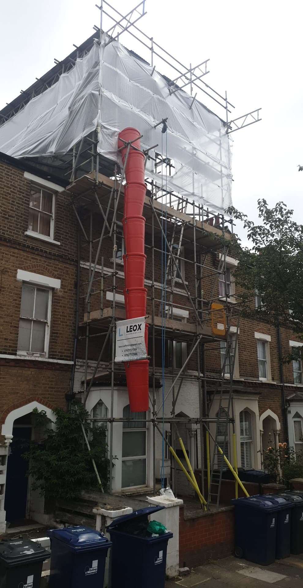 scaffolding near me London red rubbish chute